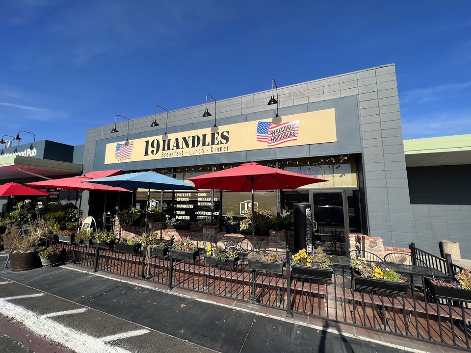 Front view of a strip-mall pub and grill.